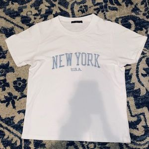 brandy melville white new york baby tee